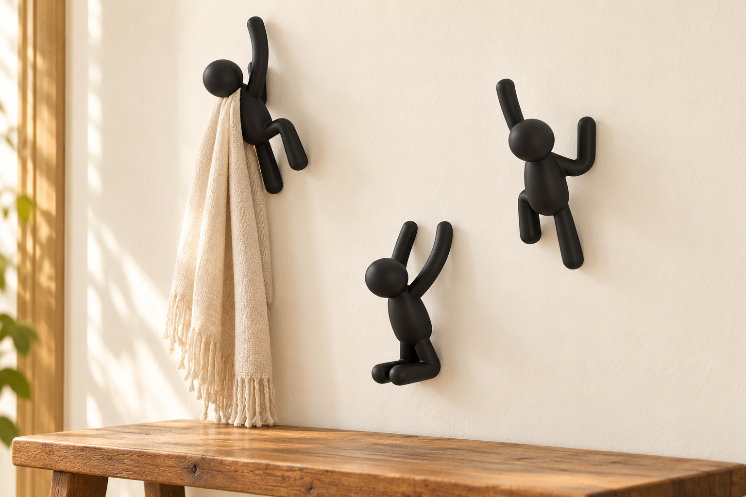 Umbra Buddy Wall Hooks - Black, Set of 3 styled in a home setting